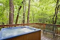 Relax in the hot tub on the deck of this affordable vacation rental